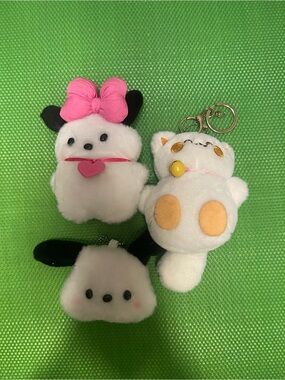 No Boundaries Plush Keychain Trio — White, Pink, Black, Yellow Accents
